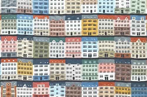 H oμορφιά της Κοπεγχάγης: Καλλιτέχνης έπλεξε τεράστια κουβέρτα εμπνευσμένη από τα πολύχρωμα σπίτια 